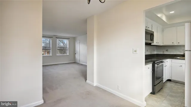 a kitchen with a stove microwave and sink