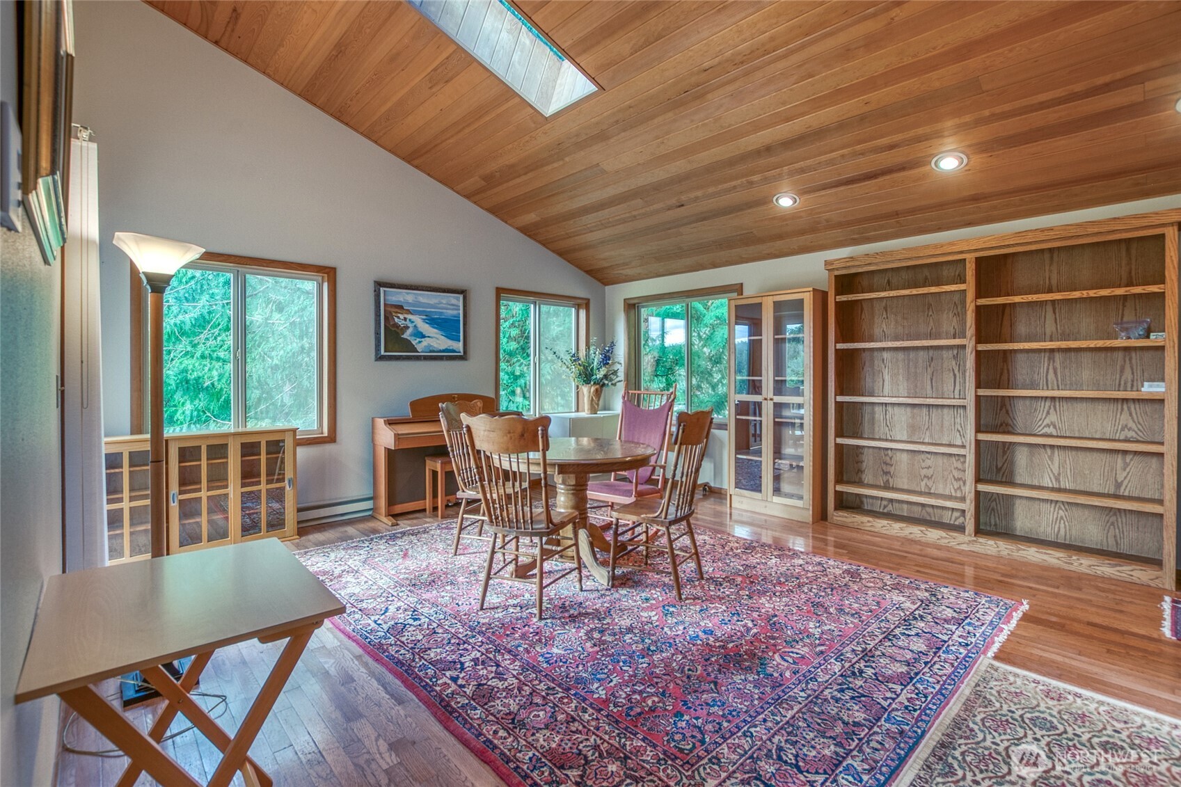 402 Cayou Valley Road Orcas Island, WA 98245 - Photo 18 of 40 a living room with furniture a rug potted plant and a large window