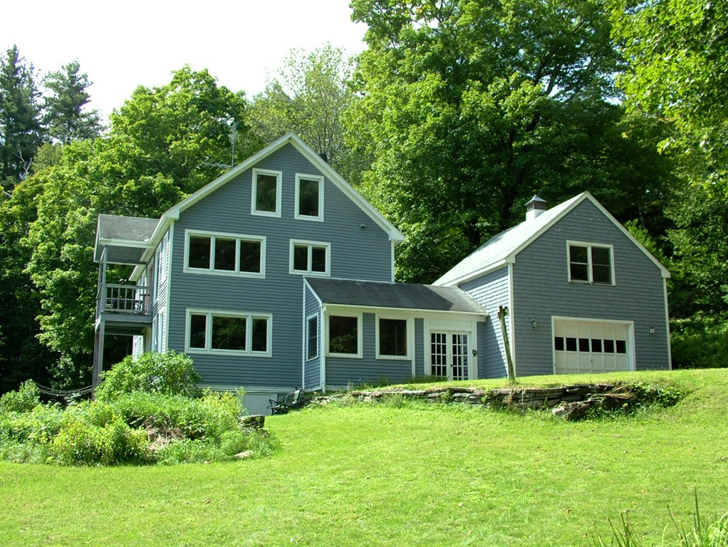 65 Potter Road Rowe, MA 01367 - Photo 1 of 30 a front view of a house with a yard