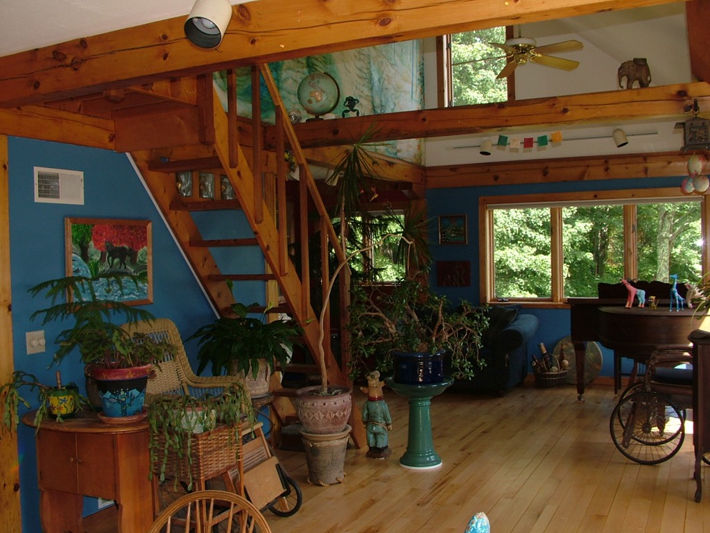 65 Potter Road Rowe, MA 01367 - Photo 14 of 30 a view of a patio with table and chairs potted plants and floor to ceiling window