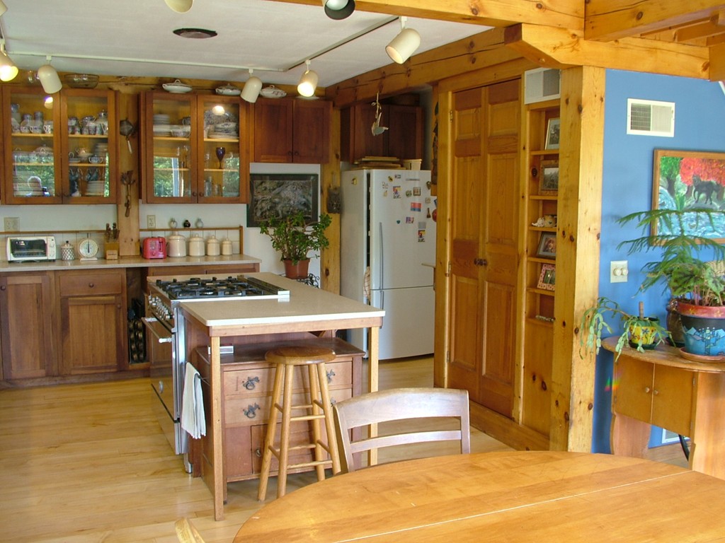 65 Potter Road Rowe, MA 01367 - Photo 16 of 30 a view of a kitchen with furniture and windows