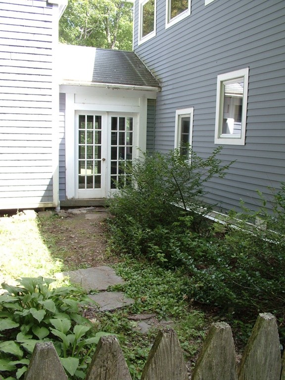 65 Potter Road Rowe, MA 01367 - Photo 7 of 30 a front view of a house with garden