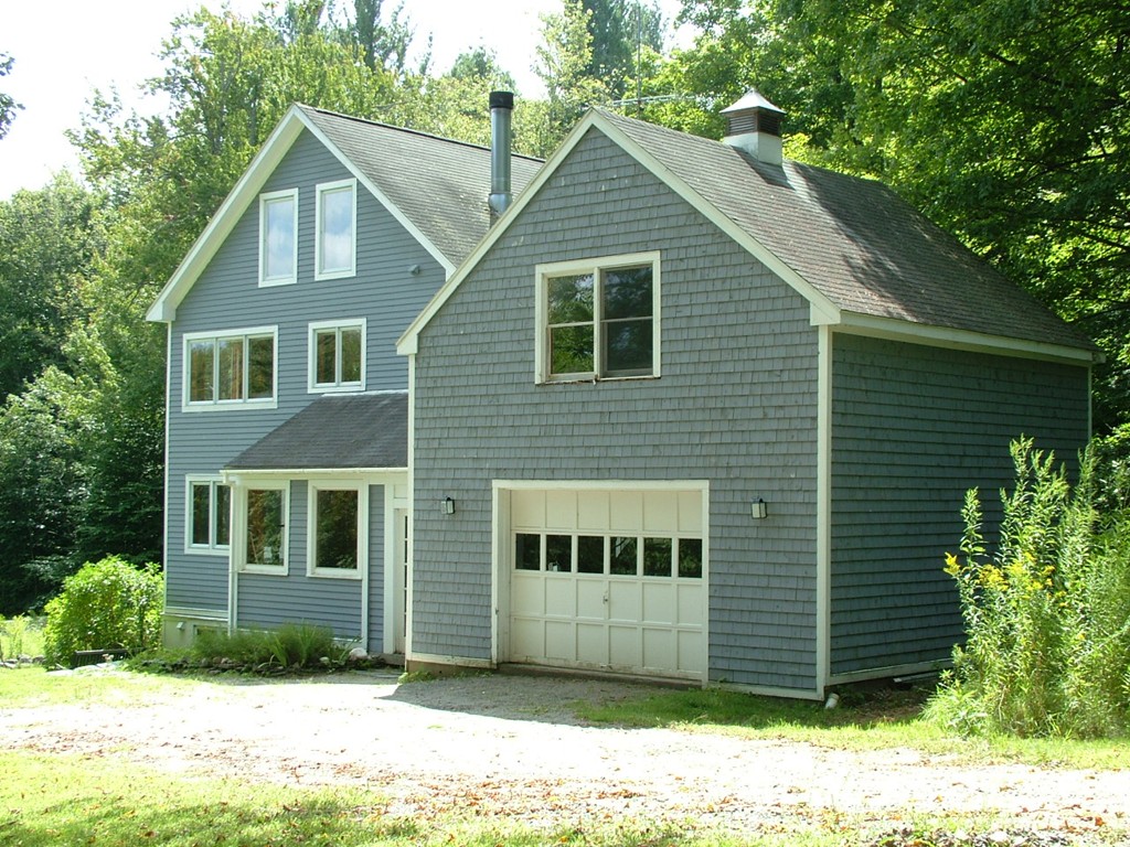 65 Potter Road Rowe, MA 01367 - Photo 9 of 30 a front view of a house with a yard