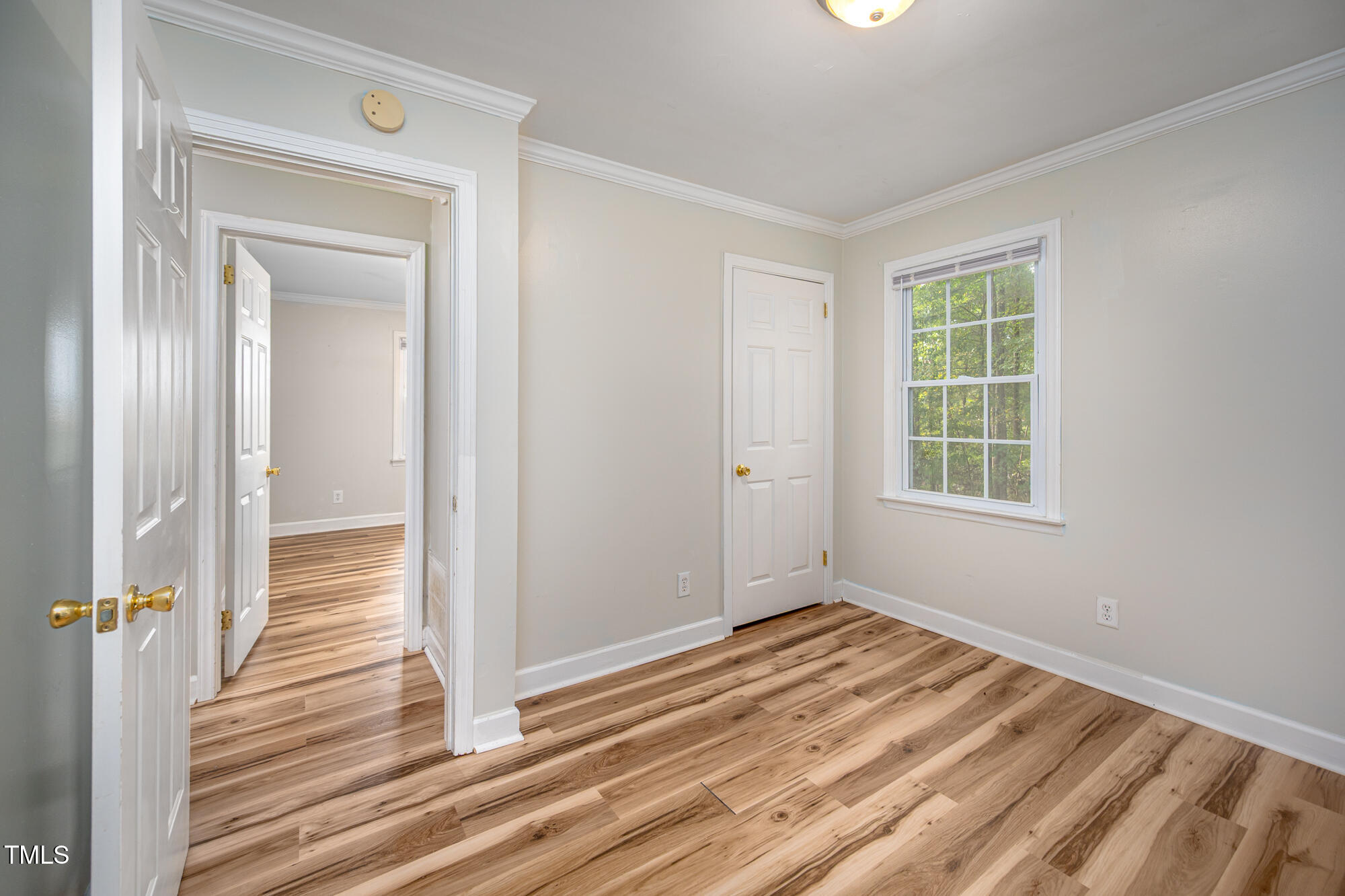 714 Dick Holeman Road Timberlake, NC 27583 - Photo 19 of 25 a view of a room with wooden floor and window