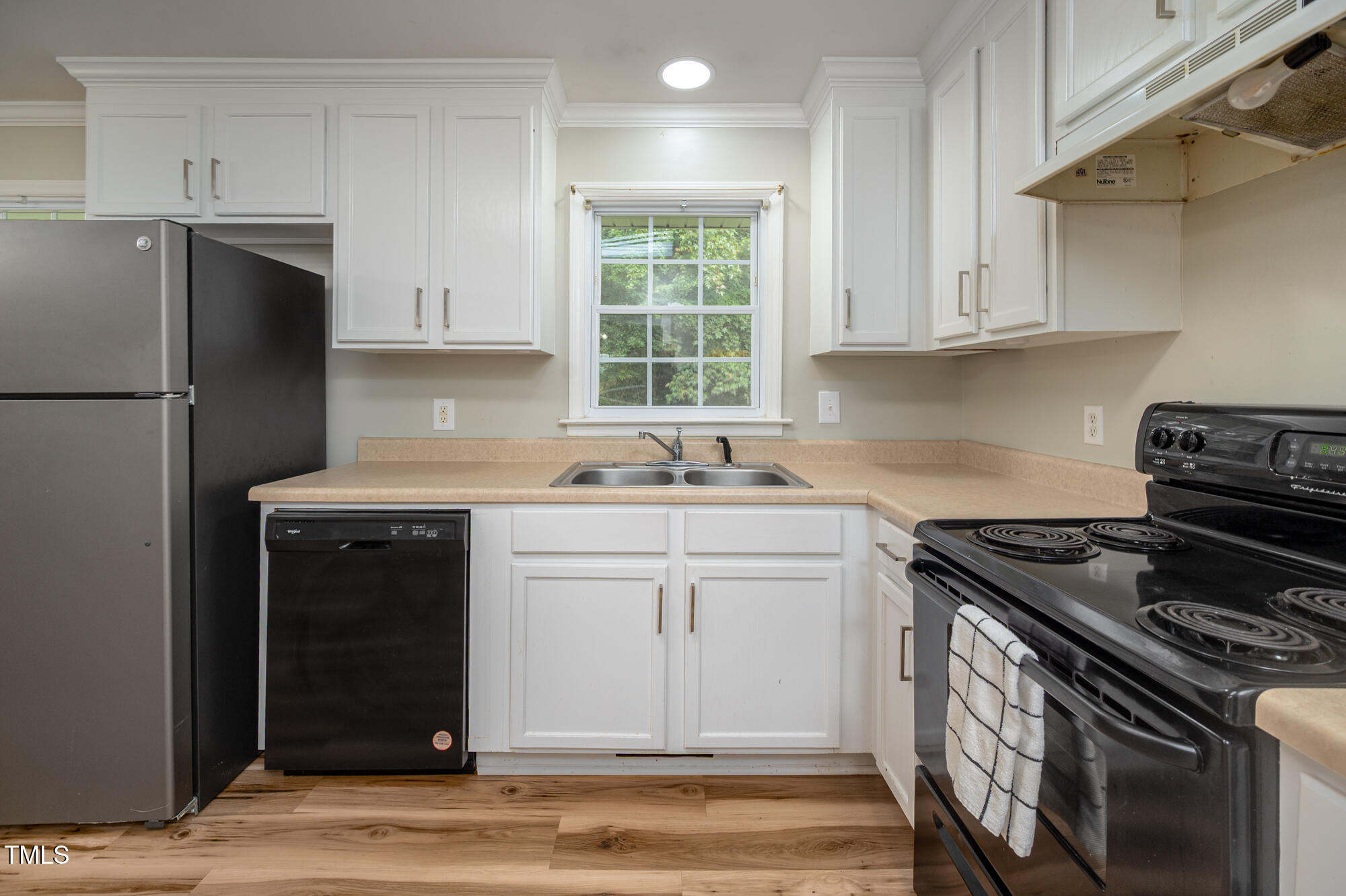 714 Dick Holeman Road Timberlake, NC 27583 - Photo 10 of 25 a kitchen with a sink stove and refrigerator