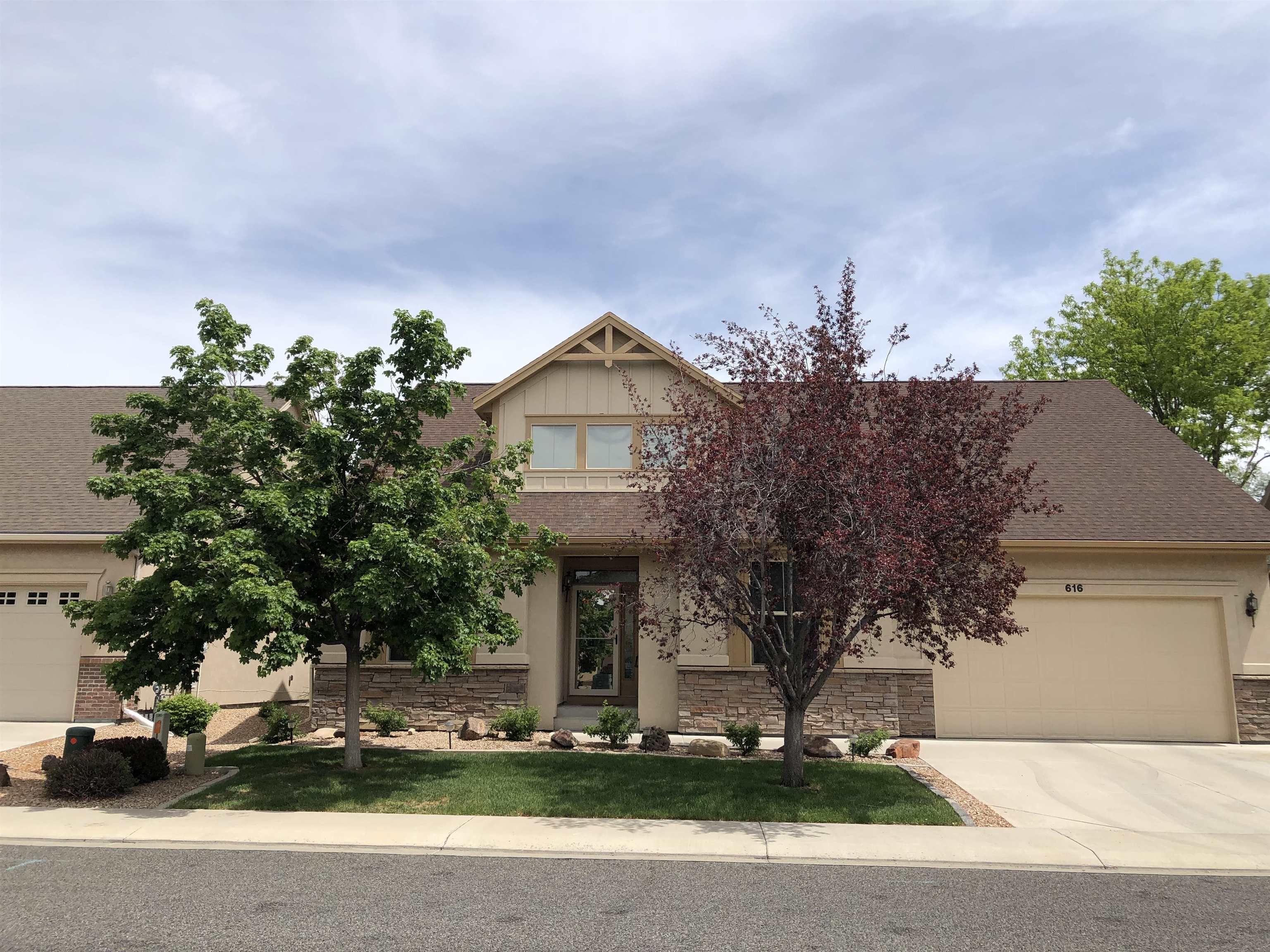 616 Saffron Way Grand Junction, CO 81505 - Photo 1 of 27 a front view of a house with garden
