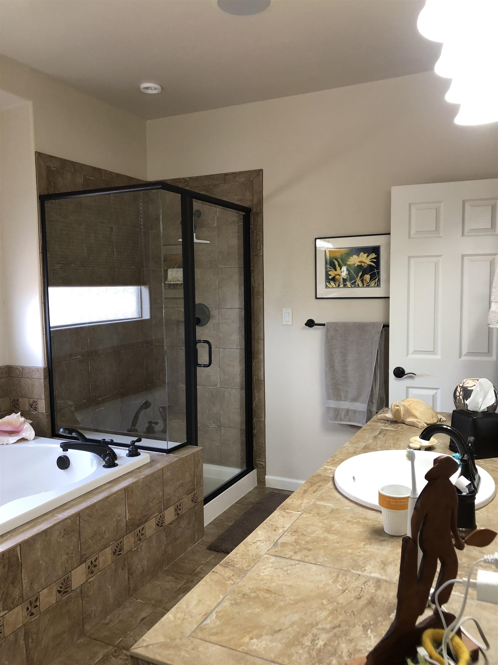 616 Saffron Way Grand Junction, CO 81505 - Photo 11 of 27 a bedroom with a bed and a flat screen tv