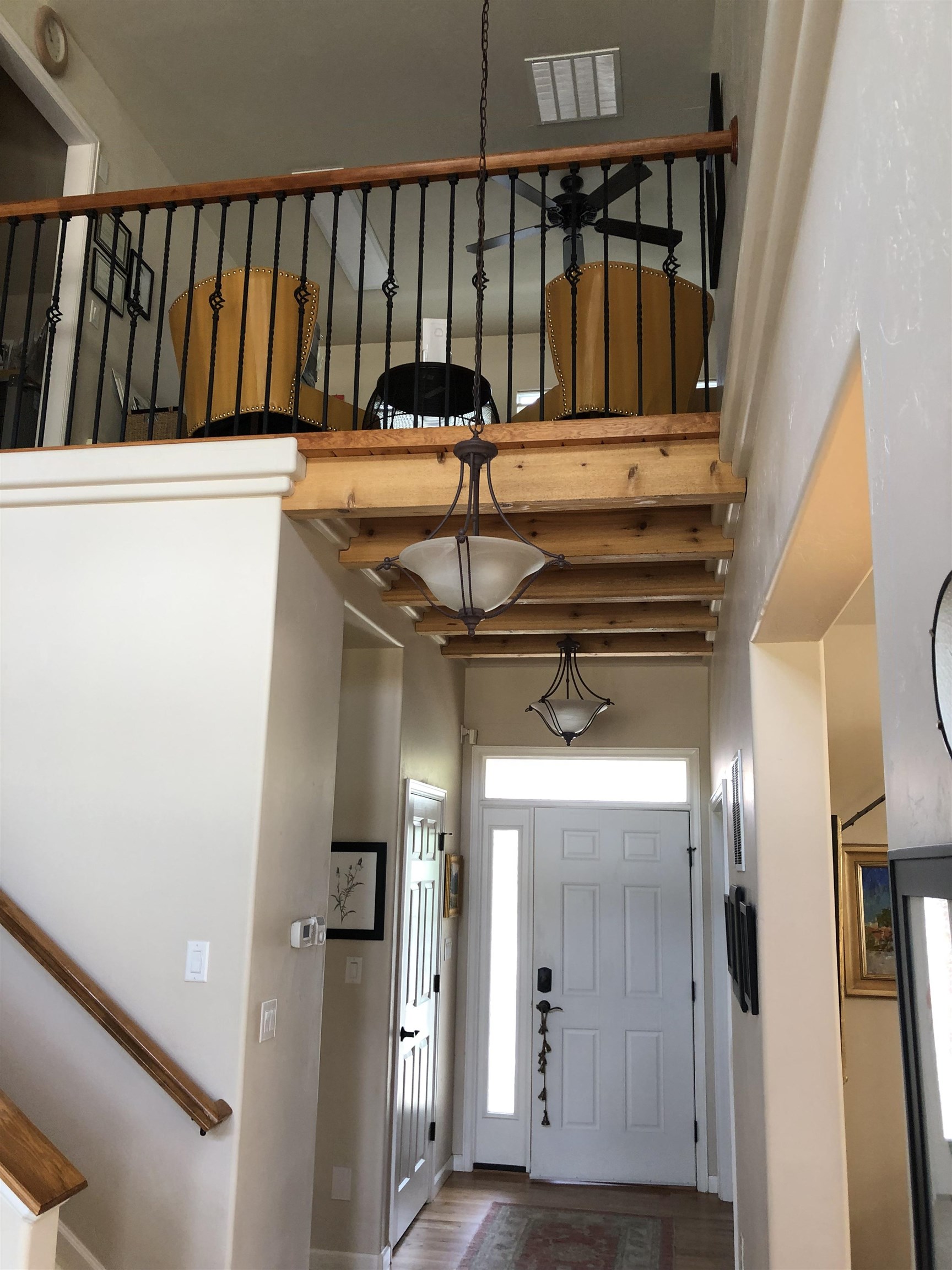 616 Saffron Way Grand Junction, CO 81505 - Photo 17 of 27 a view of hallway with wooden floor and stairs