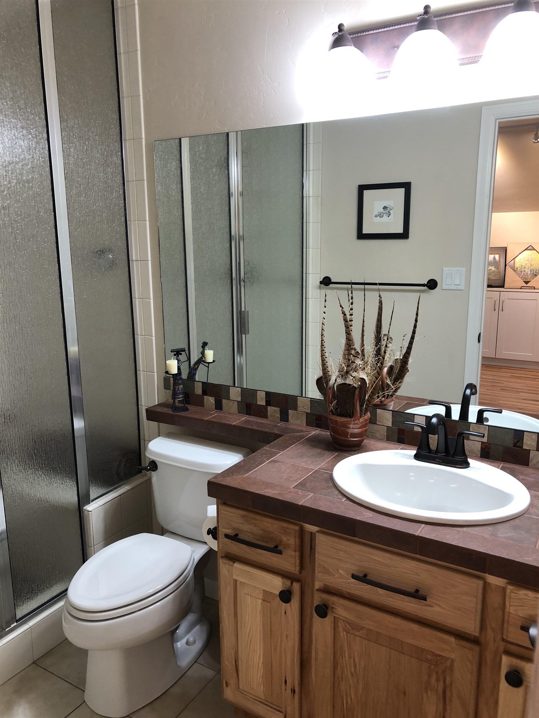 616 Saffron Way Grand Junction, CO 81505 - Photo 18 of 27 a bathroom with a toilet sink and mirror