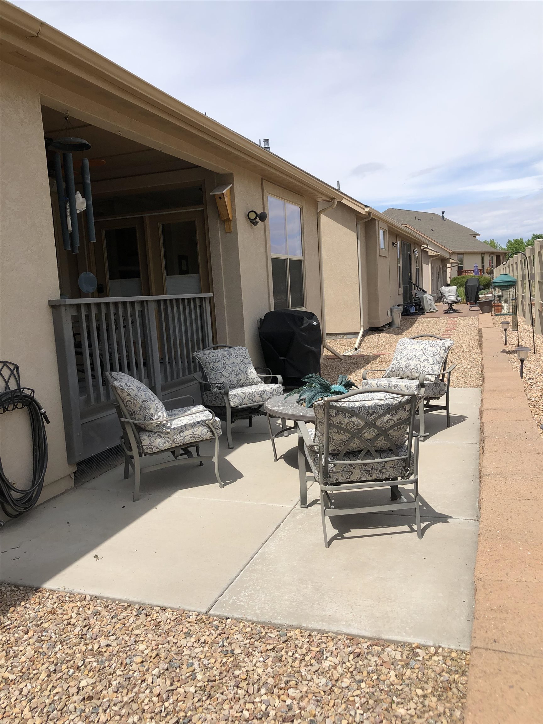 616 Saffron Way Grand Junction, CO 81505 - Photo 24 of 27 a building outdoor space with patio furniture and potted plants