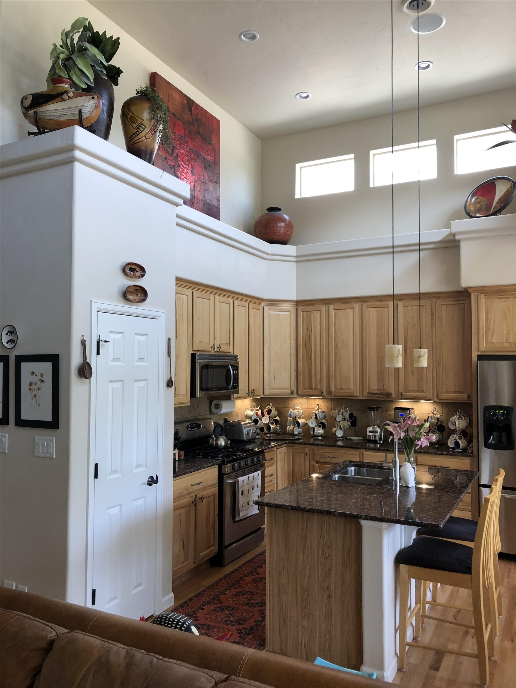 616 Saffron Way Grand Junction, CO 81505 - Photo 5 of 27 a kitchen with stainless steel appliances granite countertop a stove a sink and a refrigerator