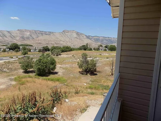 a view of a lake from a balcony