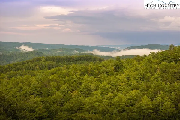 a view of a city with mountains in the background