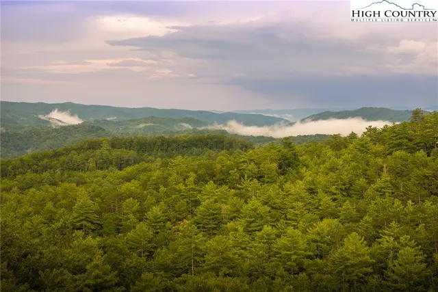 a view of a city with mountains in the background