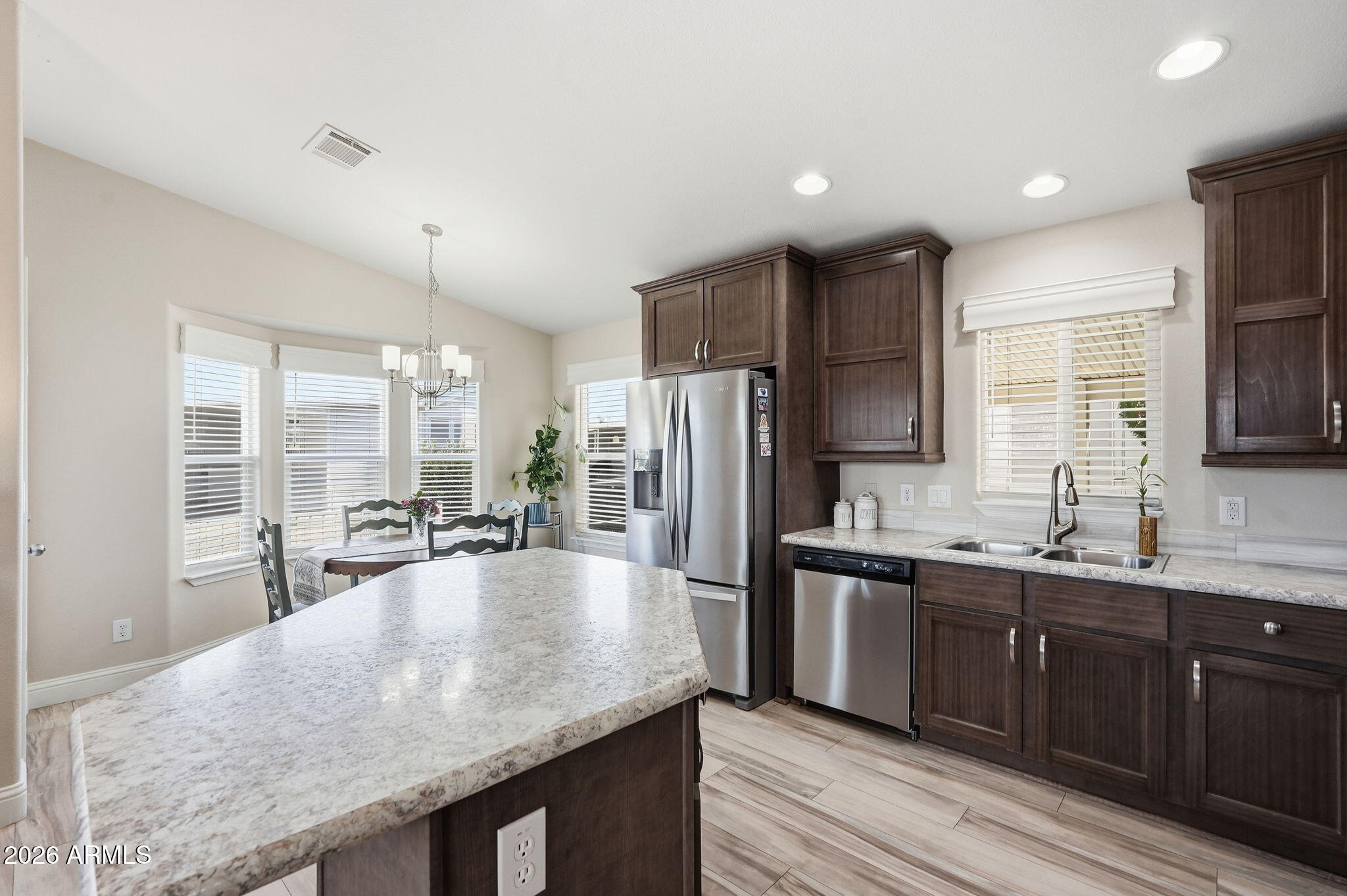 8865 East Baseline Road, Unit 1417 Mesa, AZ 85209 - Photo 13 of 47 a kitchen with stainless steel appliances granite countertop a sink stove and refrigerator