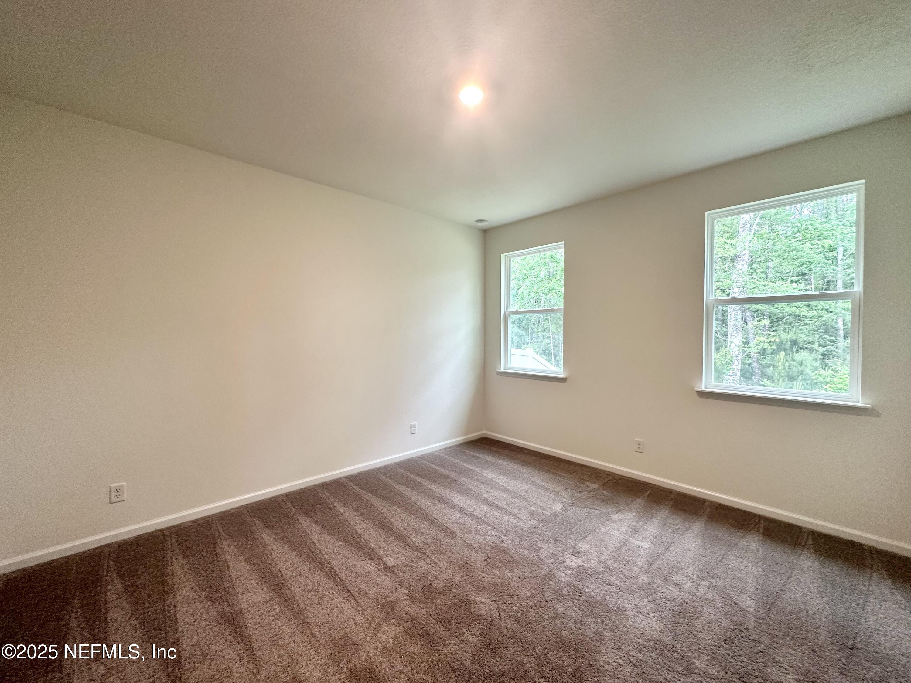 216 Rambling Brk Trail St. Johns, FL 32259 - Photo 12 of 24 an empty room with a window