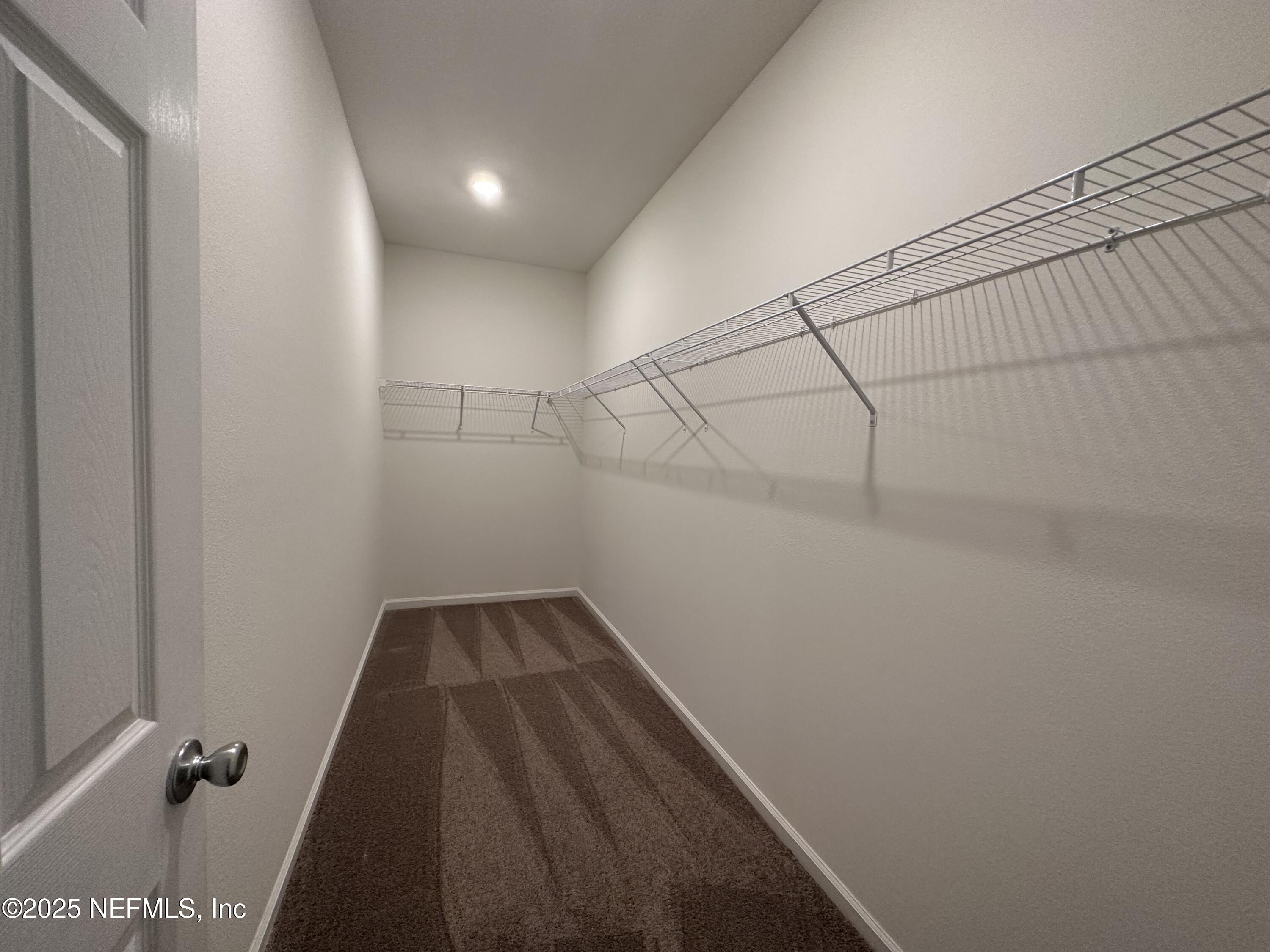 216 Rambling Brk Trail St. Johns, FL 32259 - Photo 14 of 24 a view of a room with racks on the wall