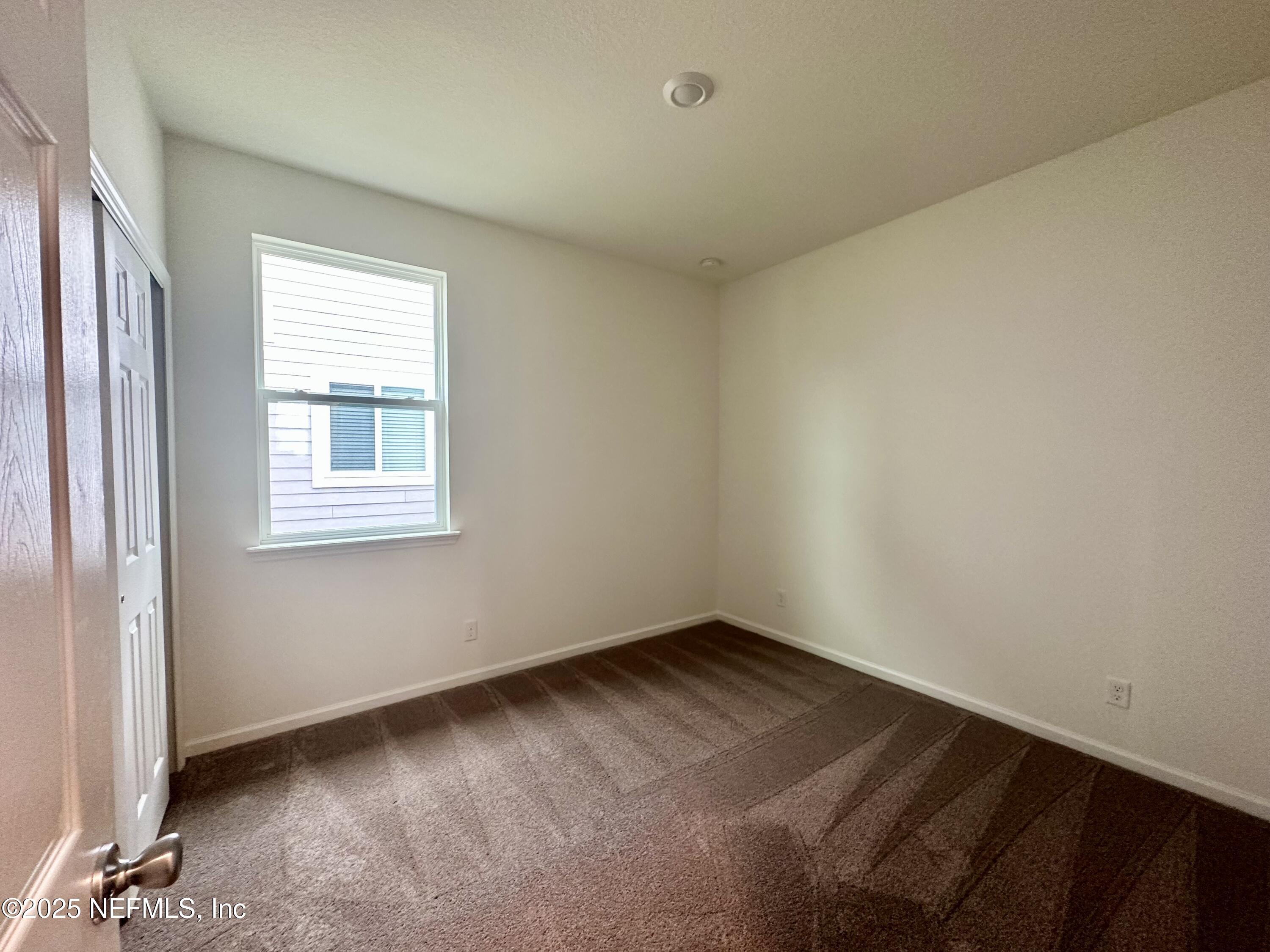 216 Rambling Brk Trail St. Johns, FL 32259 - Photo 17 of 24 an empty room with a window