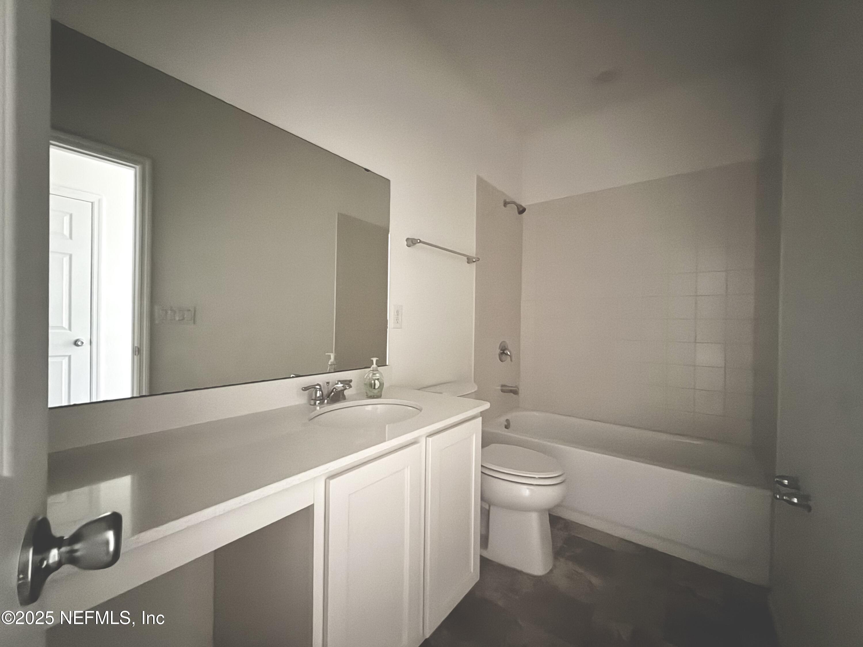 216 Rambling Brk Trail St. Johns, FL 32259 - Photo 20 of 24 a bathroom with a sink a toilet and a mirror