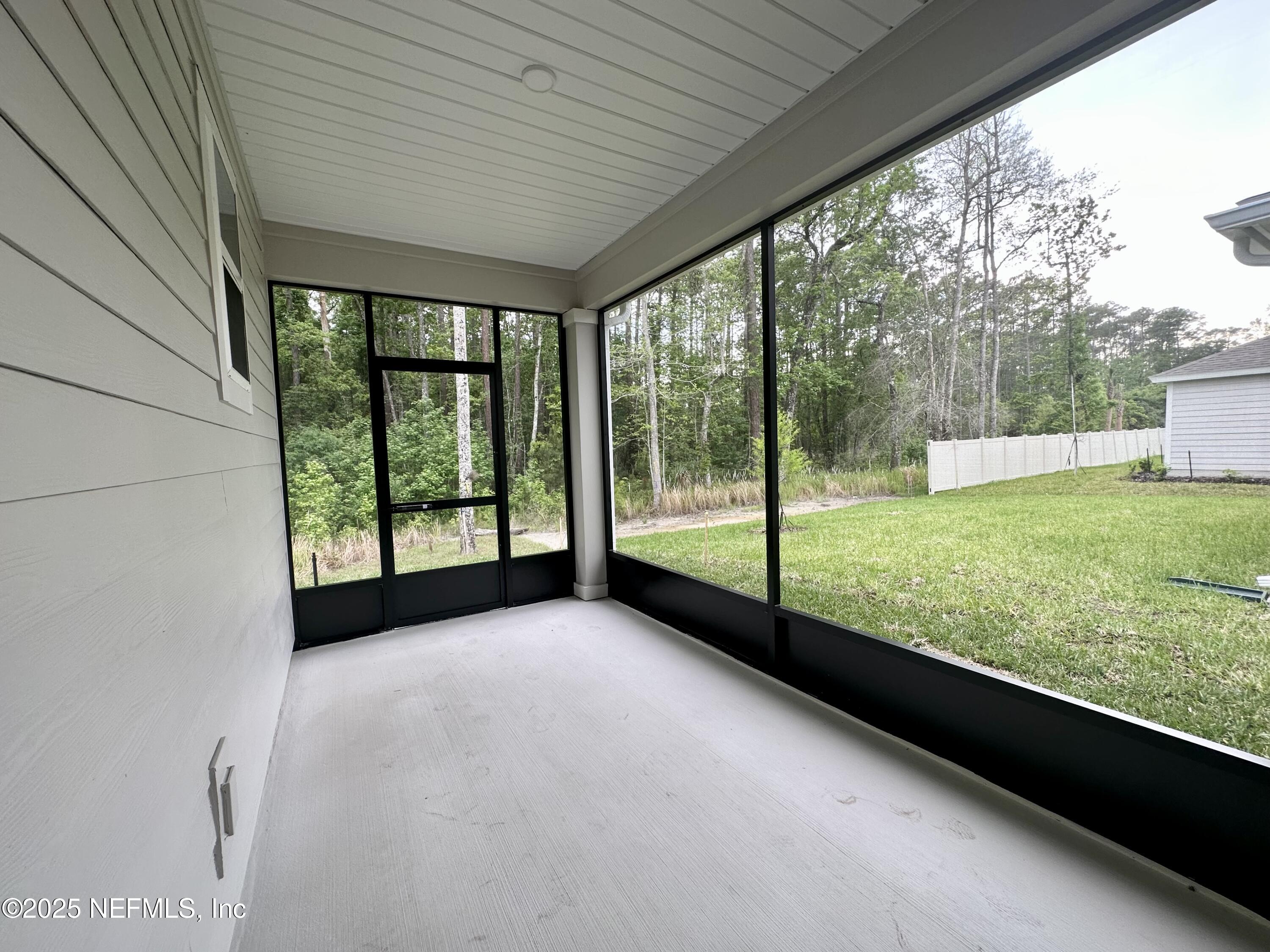 216 Rambling Brk Trail St. Johns, FL 32259 - Photo 23 of 24 a view of a garden with an outdoor seating space