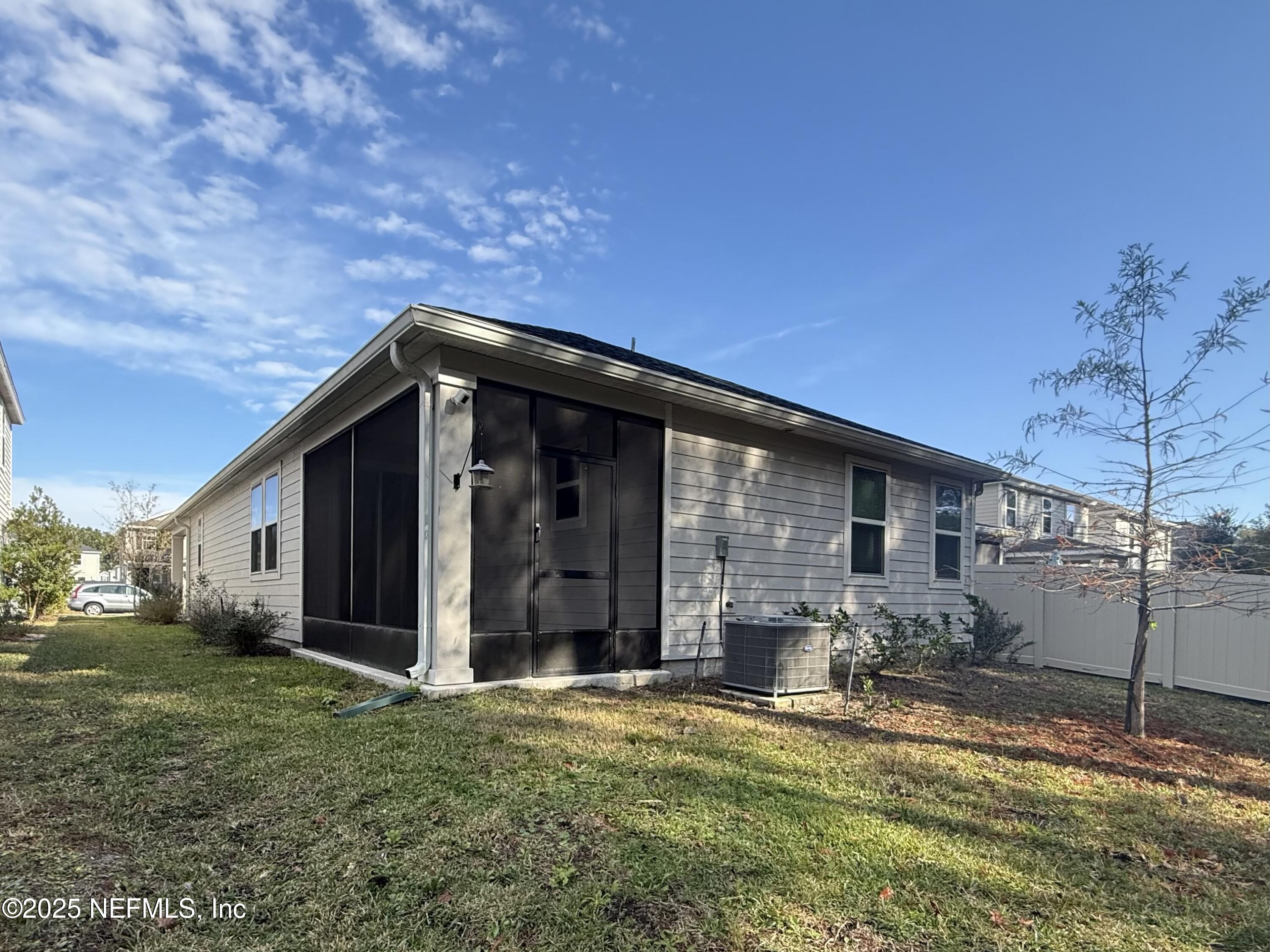 216 Rambling Brk Trail St. Johns, FL 32259 - Photo 24 of 24 a backyard of a house with yard and garage