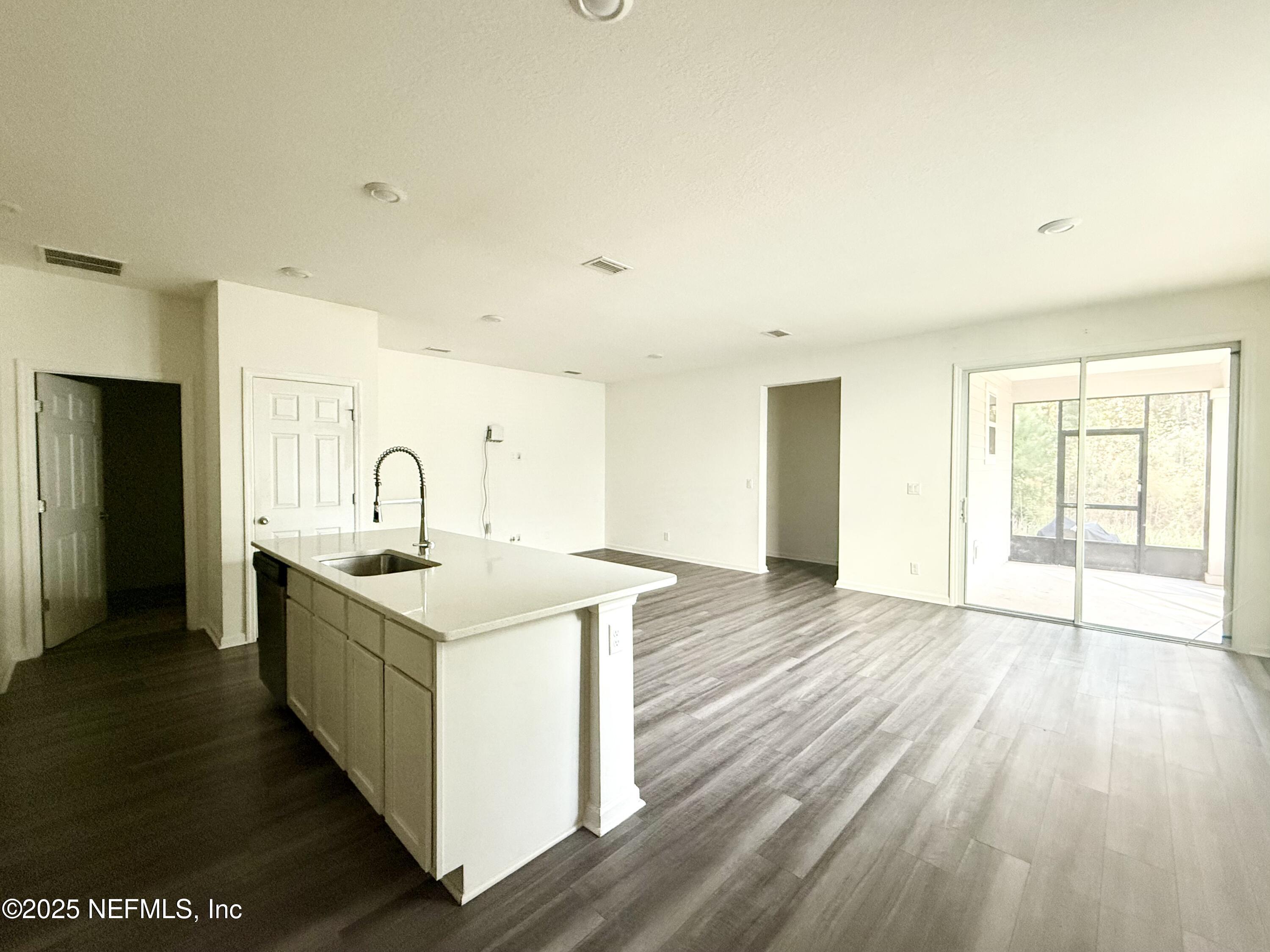 216 Rambling Brk Trail St. Johns, FL 32259 - Photo 10 of 24 a room with a sink and a wooden floor