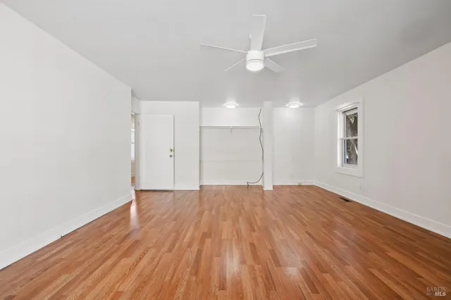 a view of an entryway with wooden floor