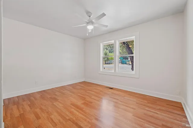 a view of a livingroom with wooden floor