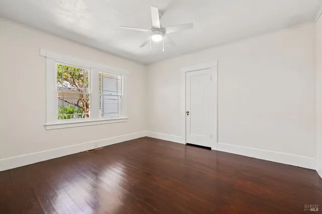 a view of a house with a tree in front