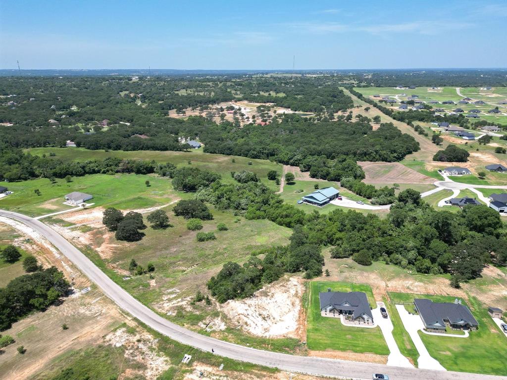 1077 Gonzollas Road Springtown, TX 76082 - Photo 6 of 16 an aerial view of residential houses with outdoor space and trees