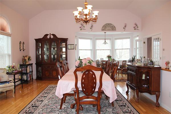 23 Marble Road Gloucester, MA 01930 - Photo 4 of 16 a view of a dining room with furniture a chandelier and wooden floor