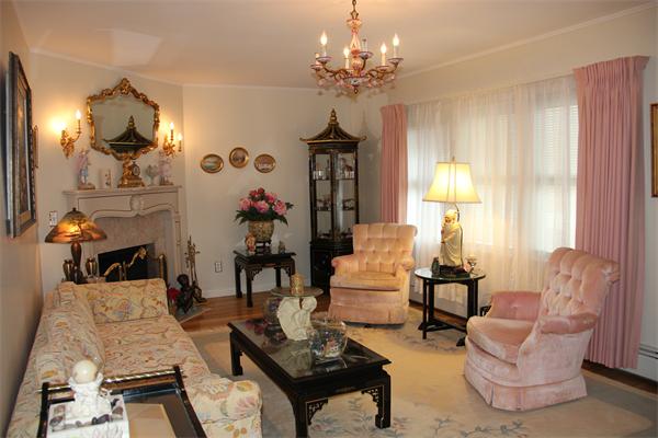 23 Marble Road Gloucester, MA 01930 - Photo 6 of 16 a living room with furniture and a chandelier