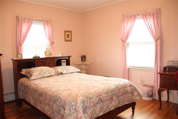 23 Marble Road Gloucester, MA 01930 - Photo 9 of 16 a bedroom with a bed and wooden floor