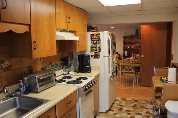 23 Marble Road Gloucester, MA 01930 - Photo 10 of 16 a kitchen with a sink stove and cabinets