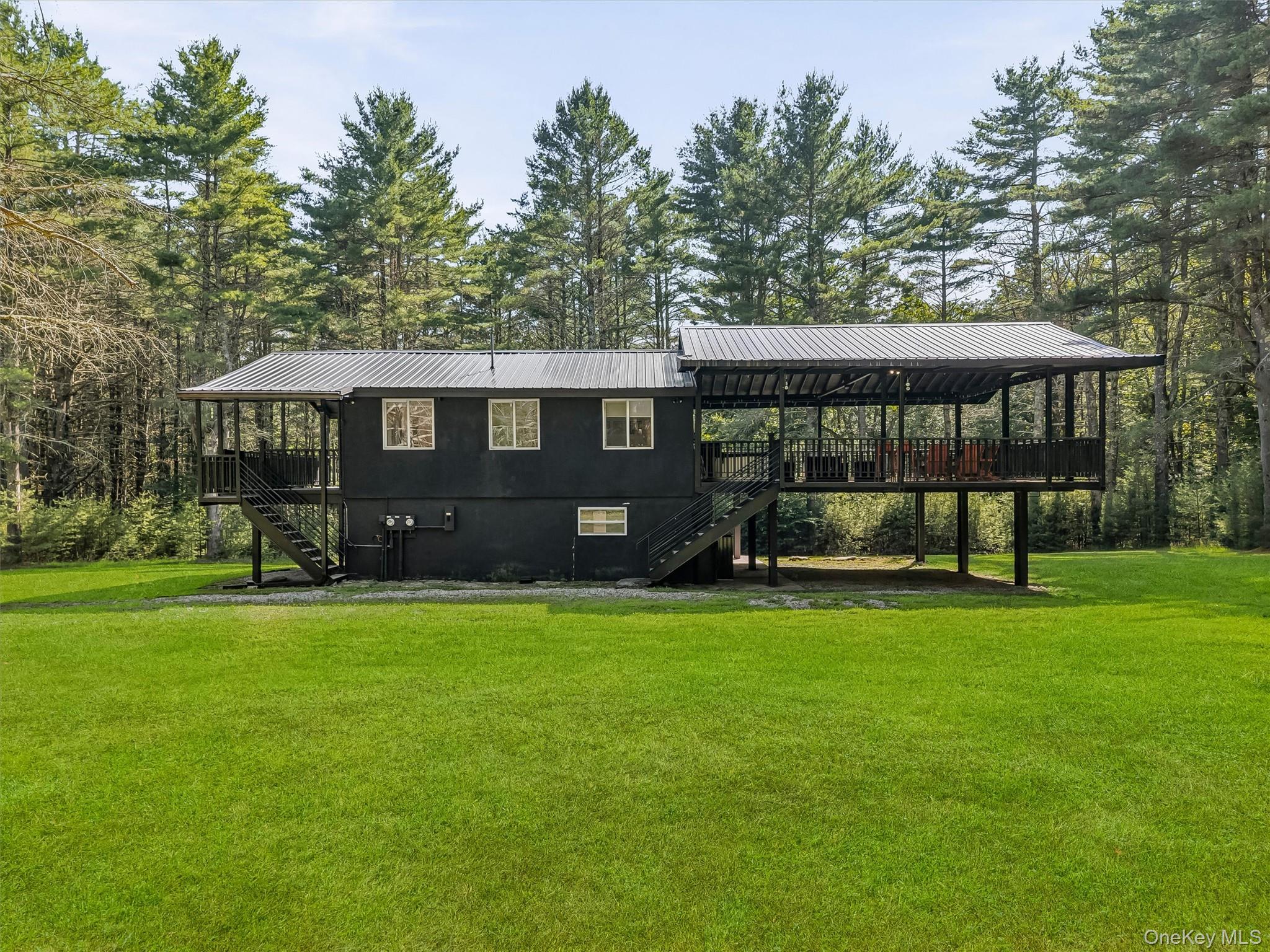 165 Dexheimer Road Narrowsburg, NY 12764 - Photo 2 of 50 Side profile showing deck and carport area