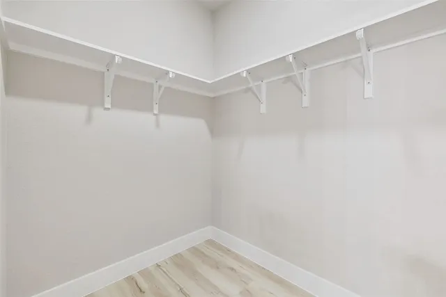 a view of an empty walk in closet