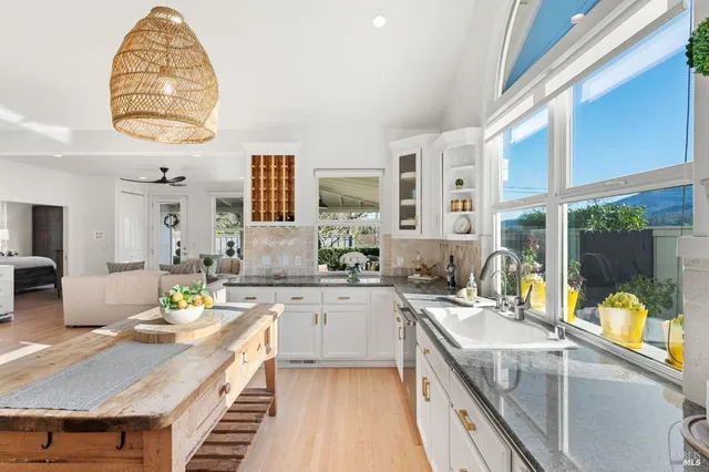 a kitchen with a stove a sink and a refrigerator