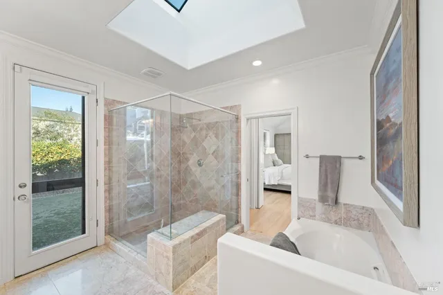 a bathroom with a tub shower and sink