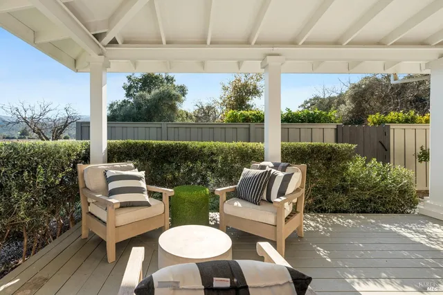 a outdoor living space with patio furniture and a garden