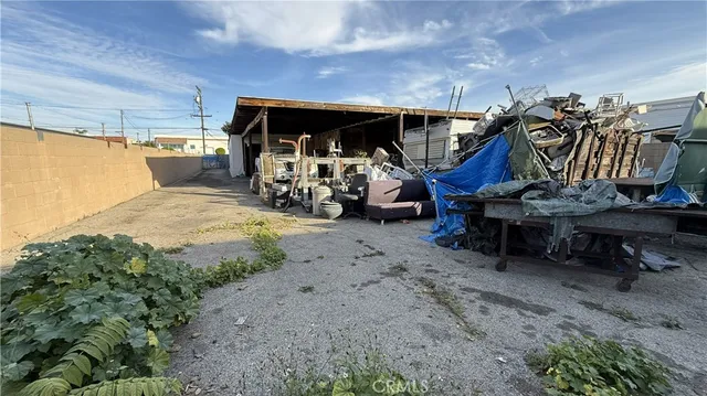 a view of a garage with a bike and white car