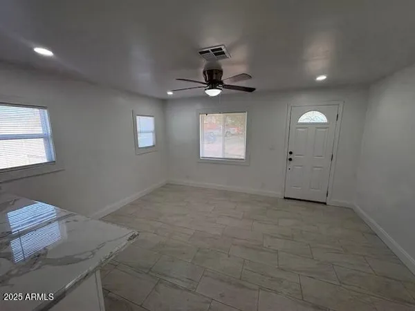 a view of an empty room with a window