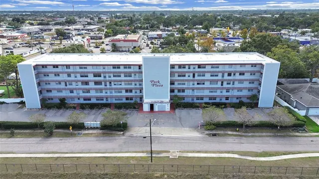 a view of a building with a yard
