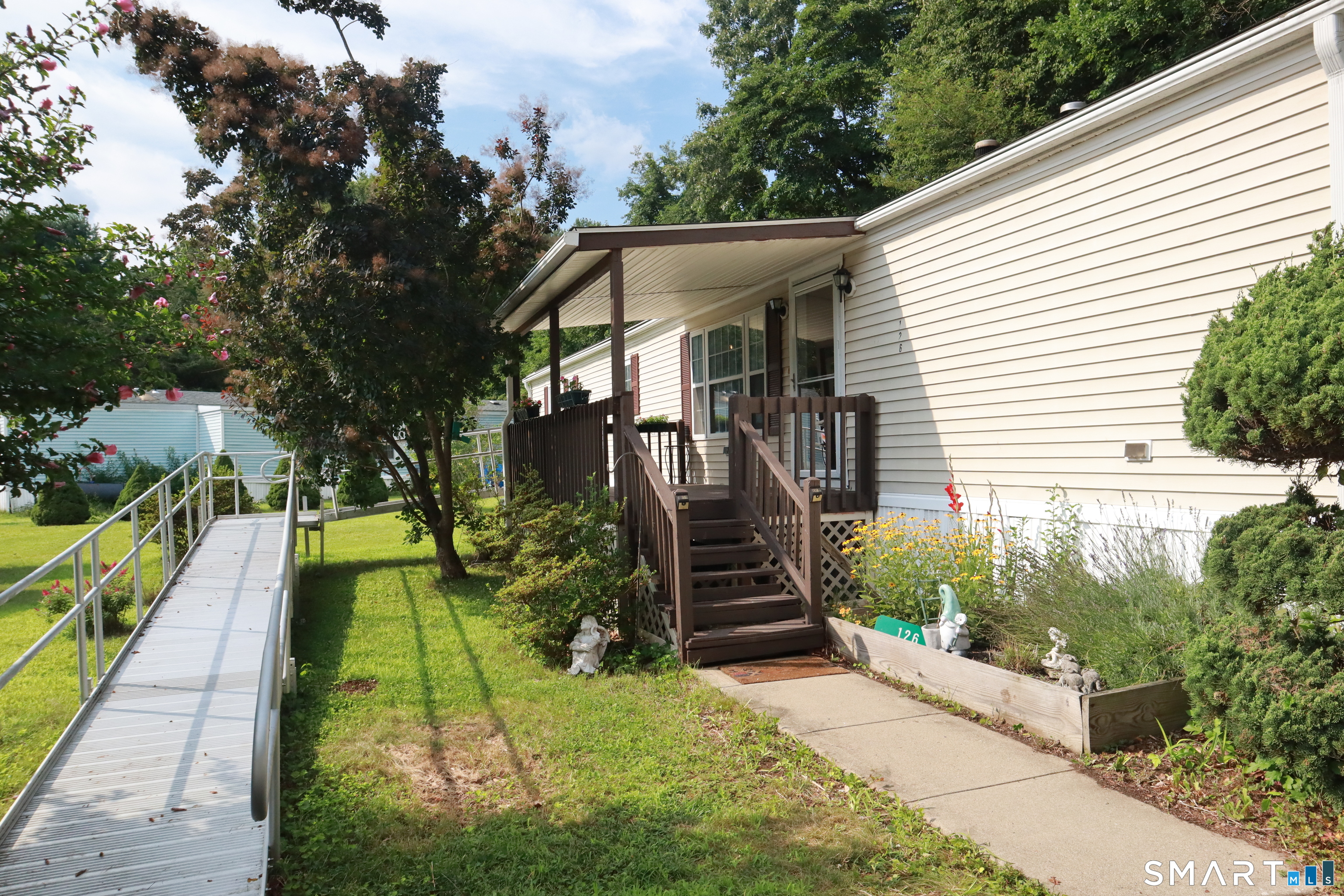 126 Williams Road Montville, CT 06370 - Photo 4 of 31 Large covered front porch with handicap ramp for ease of moving in and accessibility