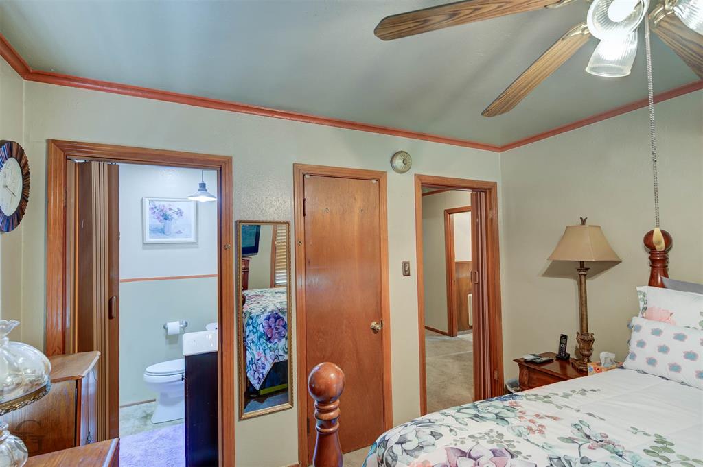 5909 Yarbrough Road Shreveport, LA 71119 - Photo 14 of 19 a bedroom with a bed and wooden floor