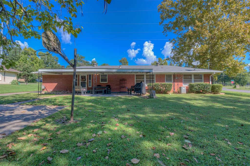 5909 Yarbrough Road Shreveport, LA 71119 - Photo 5 of 19 a view of a house with a backyard