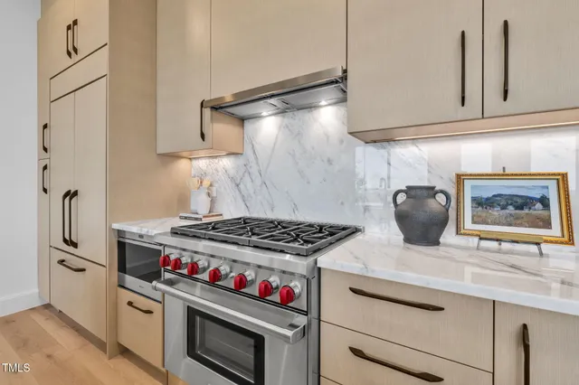 a living room with furniture and view of kitchen