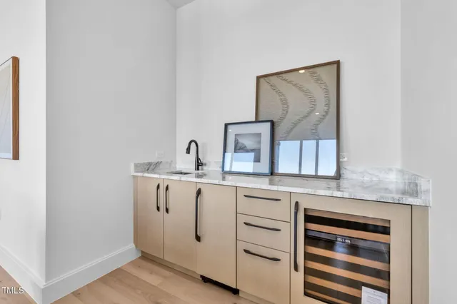 a bathroom with a granite countertop toilet sink and mirror