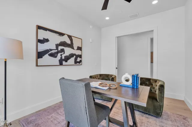a bathroom with a granite countertop sink mirror and a bathtub