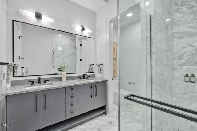 a view of a chairs and table in the balcony
