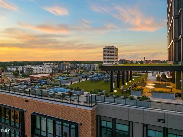 a kitchen with stainless steel appliances kitchen island wooden cabinets and entryway